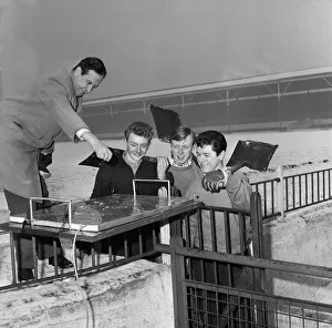 Chairman of Stoke, Albert Henshall demonstrates his vision of how an aluminium sheet over