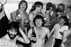 Champagne for the Villa players in the Arsenal dressing room after learning that they had