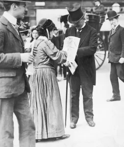 Suffragettes Prints: Chancellor of the Exchequer David Lloyd George seen here buying a