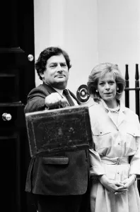 Chancellor of the Exchequer Nigel Lawson outside 11 Downing Street with his wife Therese