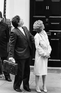 Briefcase Prints: Chancellor of the Exchequer Nigel Lawson and his wife Therese look up at their children