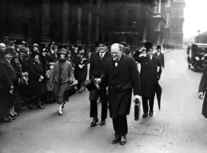00743 Prints: Chancellor of the Exchequer Winston Churchill carrying his dispatch case on his way to