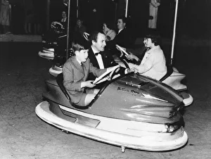 Charles in Dodgem car with David Monk, public relations officer for Betram Mills