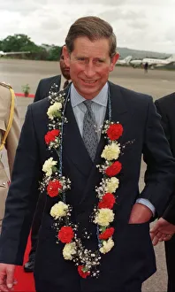 Garland Prints: Charles Prince of Wales, October 1997 Arrives in Swaziland with flower garland of