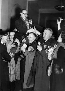 Charles Royle, first MP to be elected being chaired by the crowd as he left Salford Art