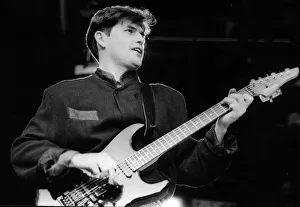 Charlie Burchill, guitarist with the rock group Simple Minds entertains the crowd