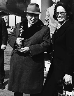 Awards And Honours Prints: Charlie Chaplin Actor At heathrow airport with his wife Dona - holding his honorary Oscar