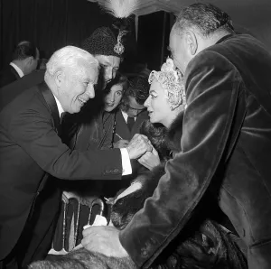 Blouse Prints: Charlie Chaplin talking with Madame Grund wife of French publisher at the Ice Ball in