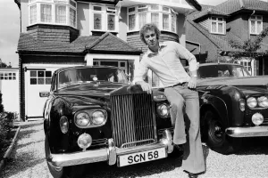 Rolls Royce Prints: Charlie George football player of Arsenal September 1975 Outside his house leaning