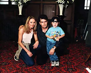 Charlie Sheen with Leandra Strand and daughter Tyla in August 1997