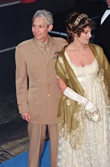 Fiftieth Prints: Charlie Watts and guest arriving at Elton Johns 50th birthday party at Hammersmith