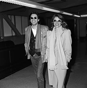 Charlotte Rampling and her husband Jean-Michel Jarre arriving at Heathrow Airport