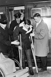 00523 Prints: Charlton Athletic footballer Mike Bailey returns to London with his wife after breaking
