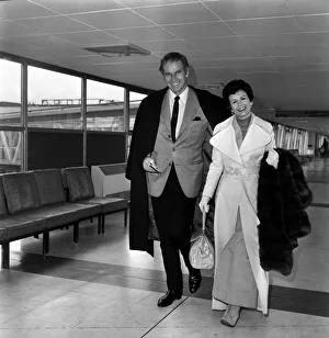 Charlton Heston, and his wife Lidia leaving London after attending the Premiere of his