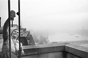 Images Dated 2nd October 2012: Charwoman at the Savoy seen here cleaning the windows of a suite that overlooks the River