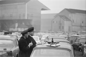 Motor Cars Prints: Chauffers enjoy a spot of lunch in the West Car Park at Twickenham whilst their