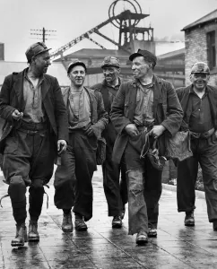 Dirty Prints: A cheerful group of miners head for the pithead baths as they come up from their shift