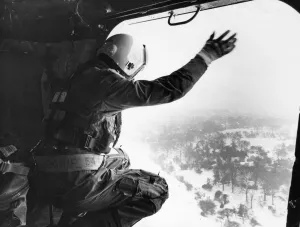 Winter Prints: A cheery wave from Master ALM Bob Danes as the RAF helicopter from 202 Squadron