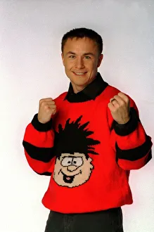 Cartoons Prints: Chelsea and England footballer Dennis Wise wearing a Dennis the menace jumper