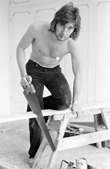 Chelsea footballer Alan Hudson tundertaking some DIY at his Putney home, May 1972