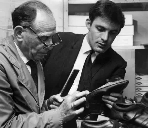 Cobbler Prints: Chelsea forward Bobby Tambling watches as his boots are specially made ahead of the 1967