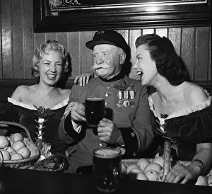 Chelsea Pensioner Dan Gorman with glamour girls Bunny Woods and Sally Malone 1956