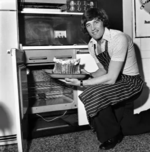 Chelsea striker Ian Hutchinson Prepares a meal for some of his team mates at his home in