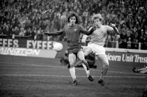 Chelsea v. Huddersfield. Chelseas new boy Tony Potrac is kicked from behind by