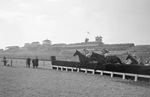 Cheltenham Gold Cup 1956. No. 12 Four Ten ridden by Tommy Cusack (left) takes a jump