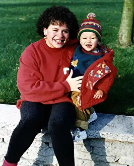 Cheryl Maker Actress who appears in TV soap Brookside sitting on wall with her son