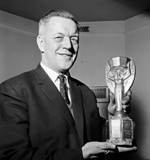 Chief Detective Inspector William Little holds the Jules Rimet World Cup trophy after it