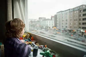 00114 Prints: Child looks through window with view of Red light district in Hamburg, West Germany