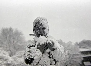 00169 Prints: Child playing in the snow after a heavy fall at Hampstead Heath January 1945