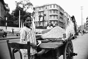 00671 Collection: A child street vendor selling chick peas on the streets of Alexandria. 29th May 1976
