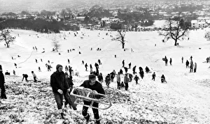 Cold Prints: Children and adults playing in the snow on the Lickey Hills in Birmingham. 28 / 12 / 1970