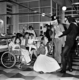 Children of Booth Hall Hospital meet character from Alice in Wonderland