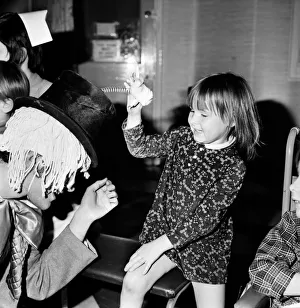 Children of booth hall hospital meet character from Alice in Wonderland