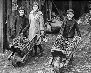Children collecting their coal ration from a coal merchant near Birmingham City centre