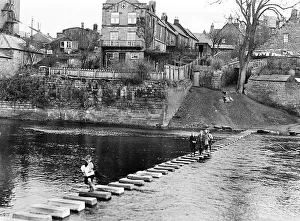 Stepping Stones Prints: Children cross the River Wansbeck on stepping stones near Bothal Wood at Morpeth