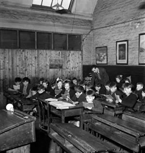 Children of the Duncan family at their school situated in a Manchester slum area