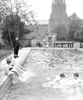 Splashing Prints: Children enjoy a dip in the pool at St Chads Cathedral School. September 1959