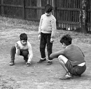 Marbles Prints: Children enjoy a game of marbles in Hillfields, Coventry. 16th August 1962