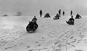 01357 Prints: Children enjoying the snow in a Bristol park 31st December 1961