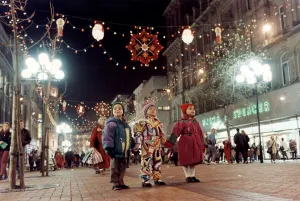 Amazement Prints: Three children only have eyes for the colourful display of Christmas lights in Church
