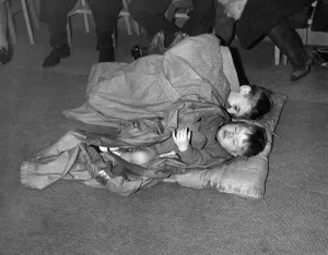 Shelter Prints: Children fast asleep in ballroom after air raid bombing of Coventry 20th November 1940