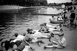 00012 Prints: Children fishing in Barking Park. August 1952 C3848-001
