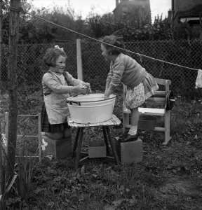 Chores Prints: Children hanging out washing on the line in class at Cookham Nursery School