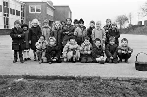 Huddersfield Prints: Children helped to complete a line of pennies stretching round their school playground