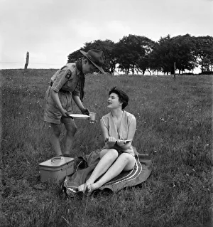 Children Humour - Boy Scout Ronald Shepherd with sun bathing beauty queen Jacqueline