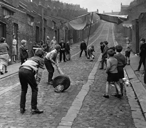 Children kids playing cricket in the back lane street in Newcastle 1962 - Children